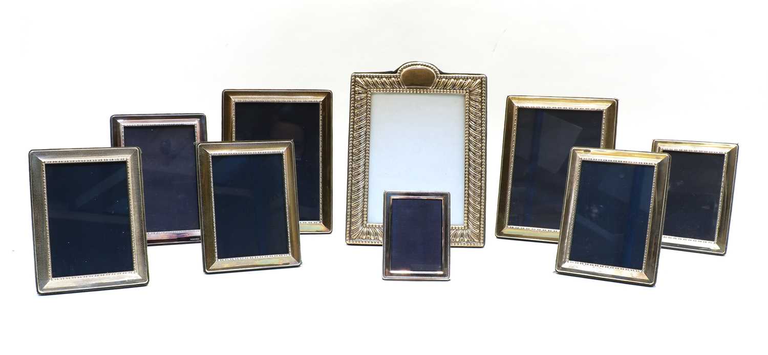 Lot 97 - Nine beaded silver easel back photograph frames
