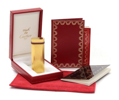 Lot 1479 - A cased Must de Cartier gold plated gas lighter, c.1990