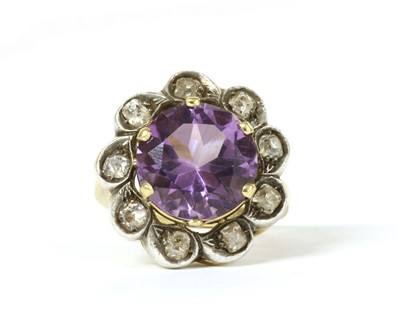 Lot 156 - A silver and gold, amethyst and diamond cluster ring