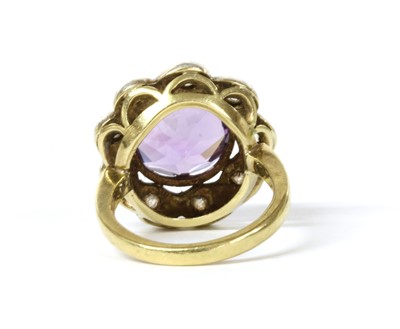 Lot 156 - A silver and gold, amethyst and diamond cluster ring