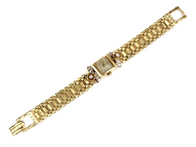 Lot 197 - An American diamond set two colour gold mechanical cocktail watch, c.1950