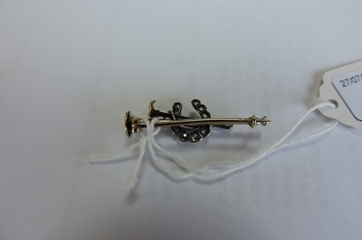 Lot 49 - A cased diamond set hunting horn, horseshoe and crop bar brooch, c.1900