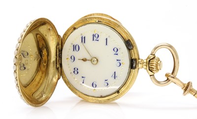 Lot 121 - A Swiss gold enamel and split pearl mechanical fob watch