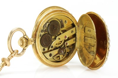 Lot 121 - A Swiss gold enamel and split pearl mechanical fob watch