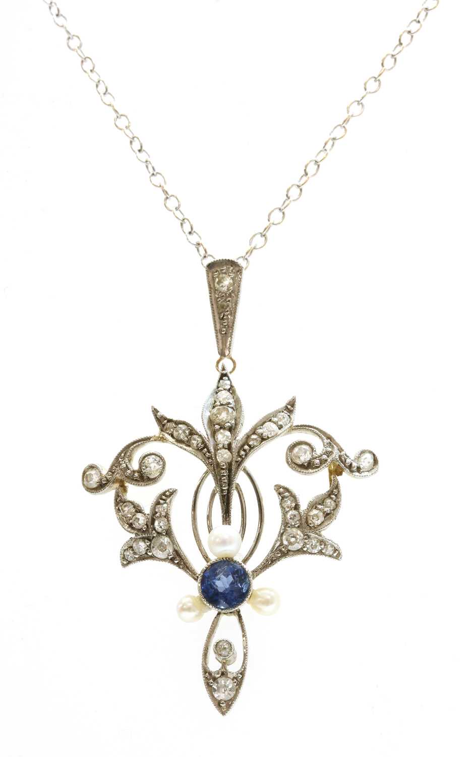 Lot 109 - A sapphire, seed pearl and diamond pendant, c.1910