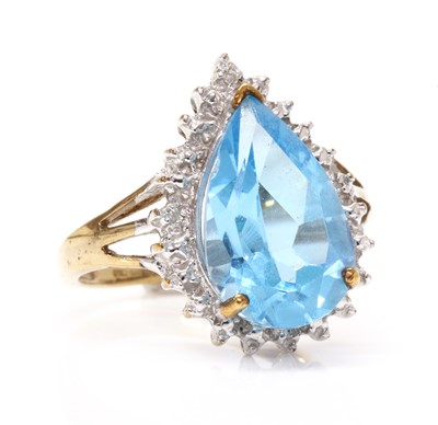 Lot 1273 - A 9ct gold blue topaz and diamond teardrop ring