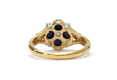 Lot 1303 - A 9ct gold diamond and lapis lazuli cluster ring