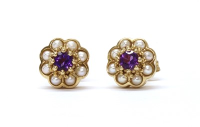 Lot 1252 - A pair of 9ct gold amethyst and split pearl cluster earrings