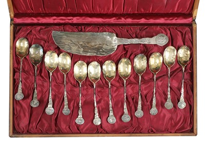 Lot 510 - A cased set of twelve American silver ice cream spoons and cutter