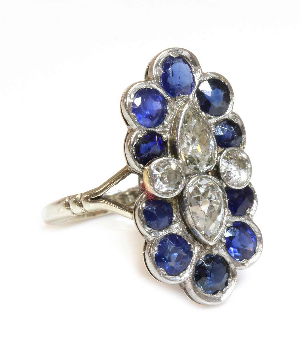 Lot 151 - A diamond and sapphire fingerline cluster ring, c.1935