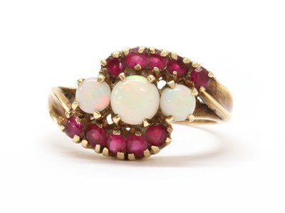 Lot 173 - A gold opal and synthetic ruby ring