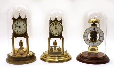Lot 290 - Two brass torsion clocks