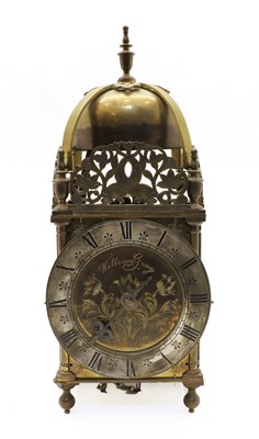 Lot 366 - A brass lantern clock