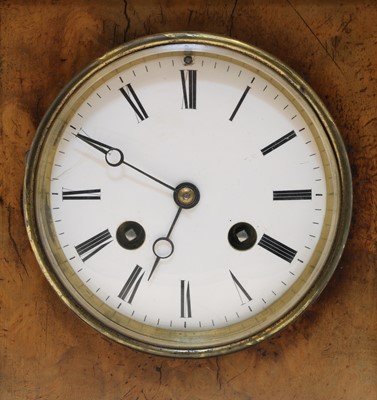 Lot 338 - A walnut and ebonised mantel clock