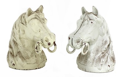 Lot 783 - A pair of cast iron horse's head stable brackets