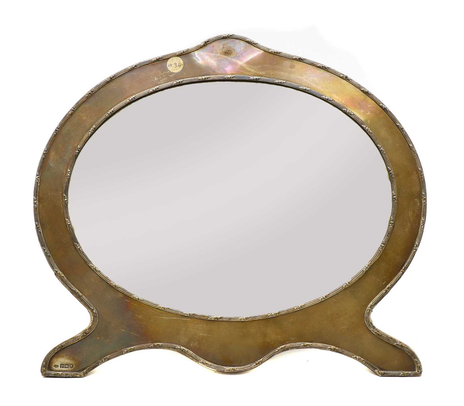 Lot 54 - An oval silver easel dressing mirror