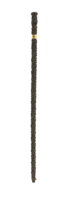 Lot 318 - A carved Irish stick
