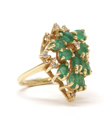 Lot 143 - A gold emerald and diamond cluster ring