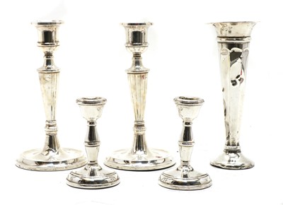 Lot 21 - A pair of silver candlesticks