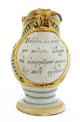Lot 449 - An Italian maiolica wine jug for the Greek market
