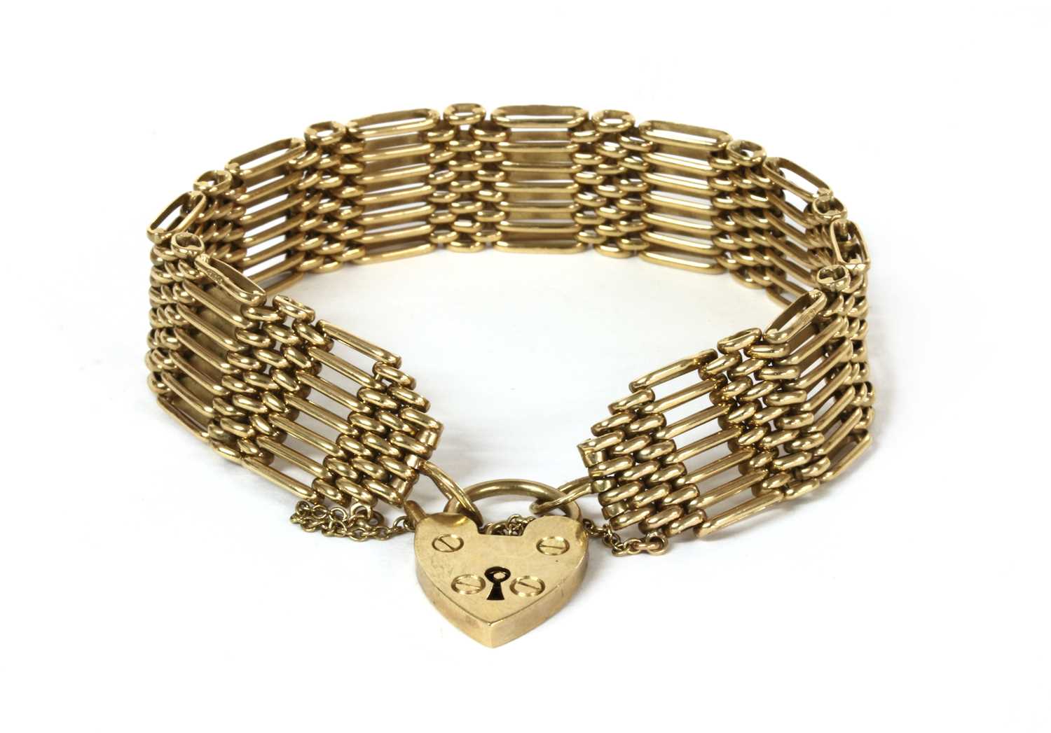 Lot 100 - A 9ct gold seven row gate bracelet
