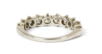 Lot 1203 - A platinum diamond half eternity ring, c.1950
