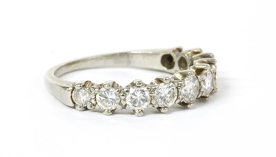Lot 1203 - A platinum diamond half eternity ring, c.1950