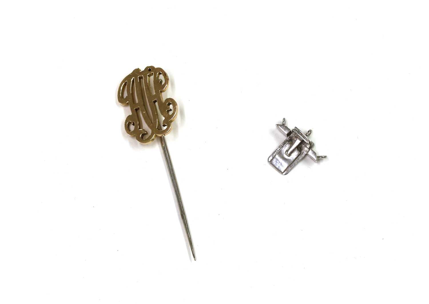 Lot 1402 A gold monogram stick pin,