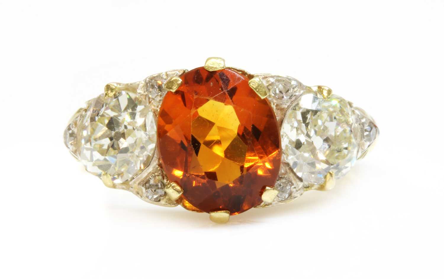 Lot 38 - A late Victorian citrine and diamond boat shaped carved head ring