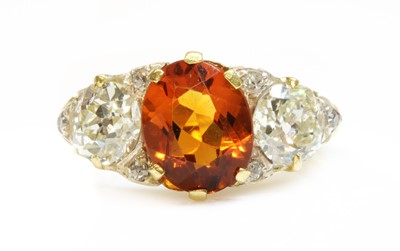 Lot 38 - A late Victorian citrine and diamond boat shaped carved head ring
