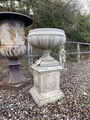Lot 475 - A composite stone garden urn