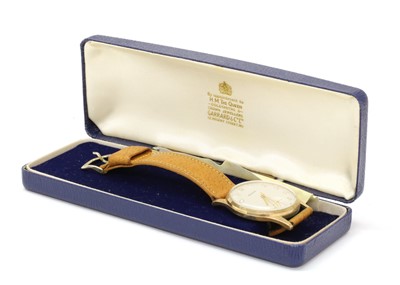Lot 233 - A gentlemen's 9ct gold Garrard mechanical strap watch