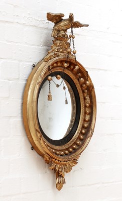 Lot 10 - A Regency giltwood convex mirror