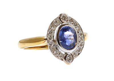 Lot 298 - An 18ct yellow and white gold sapphire and diamond oval cluster ring