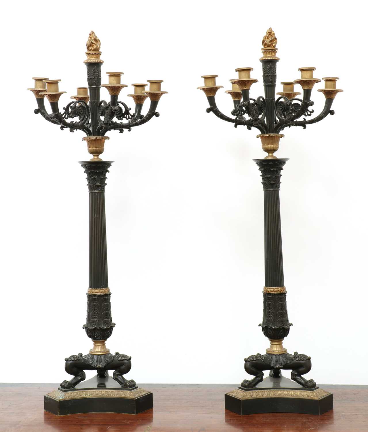 Lot 21 - A pair of large gilt and patinated bronze seven-light candelabra