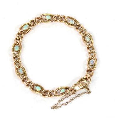 Lot 6 - An Edwardian gold opal set curb bracelet