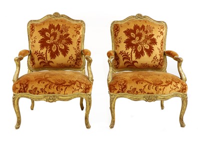 Lot 27 - A pair of French Louis XV giltwood fauteuils à la reine
