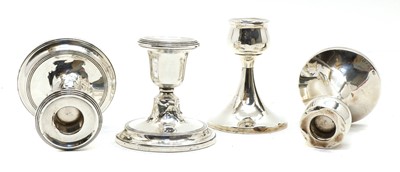 Lot 122 - Two pairs of silver candlesticks