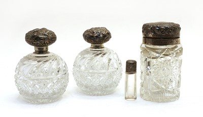 Lot 123 - A collection of silver topped glass jars