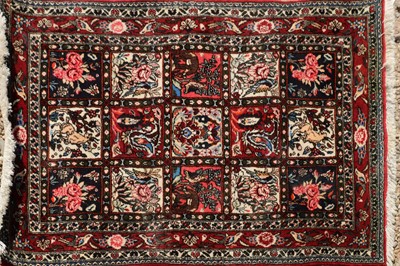 Lot 435 - A small Persian wool garden pattern rug