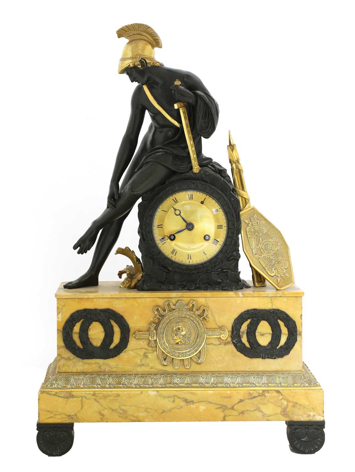 Lot 52 - A French Empire patinated and gilt-bronze and Sienna marble mantel clock