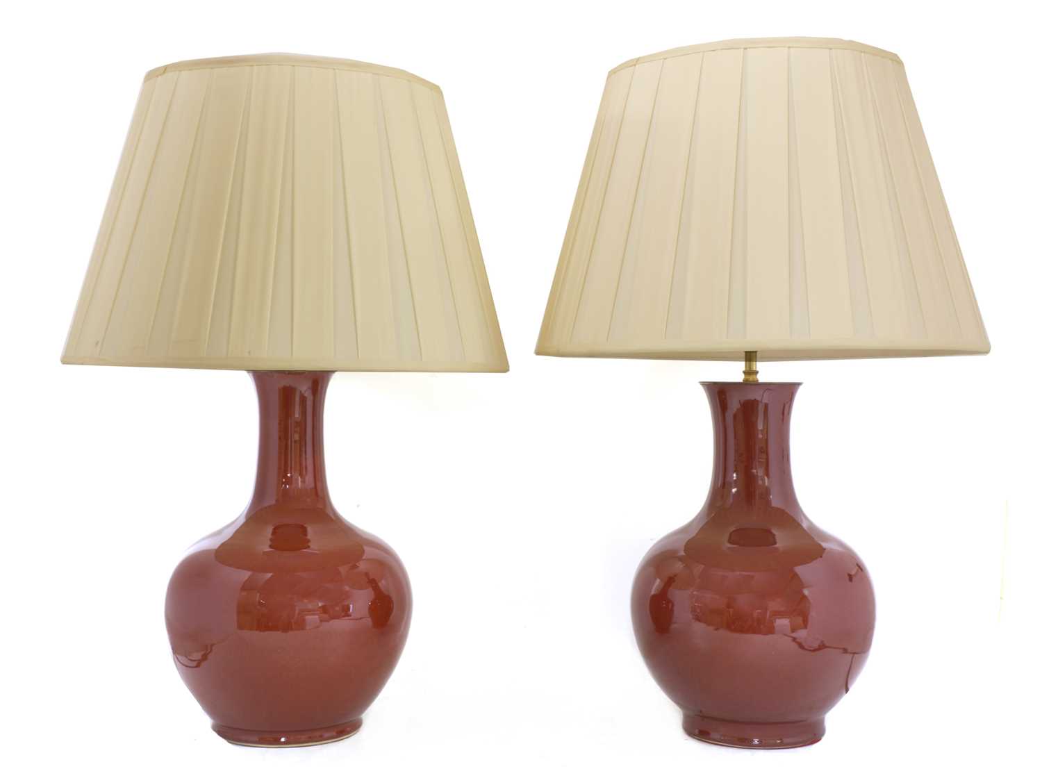 Lot 43 - A pair of Chinese-style porcelain sang-de-boeuf table lamps