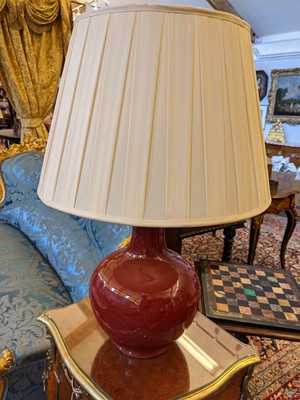 Lot 43 - A pair of Chinese-style porcelain sang-de-boeuf table lamps
