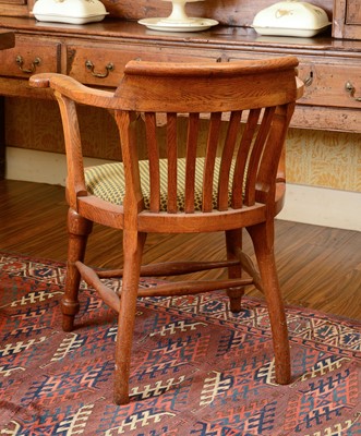 Lot 261 - An oak desk chair