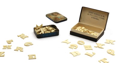 Lot 122 - Two sets of bone alphabet letters