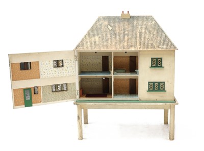 Lot 156 - A large 1930's painted wood doll's house on stand