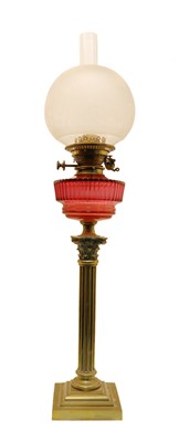 Lot 134 - A brass duplex oil lamp
