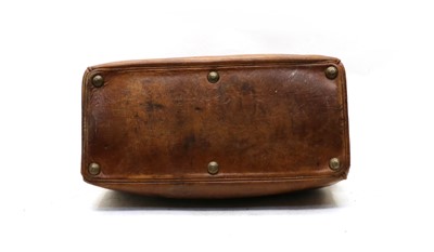 Lot 94 - A vintage crocodile suitcase with brass fittings