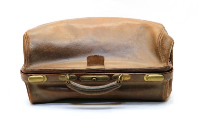 Lot 94 - A vintage crocodile suitcase with brass fittings