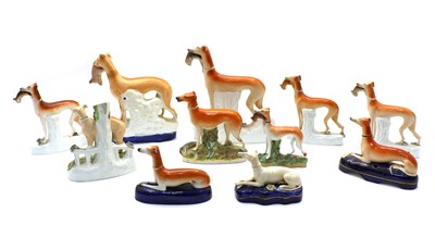 Lot 201 - Eleven Staffordshire pottery greyhounds